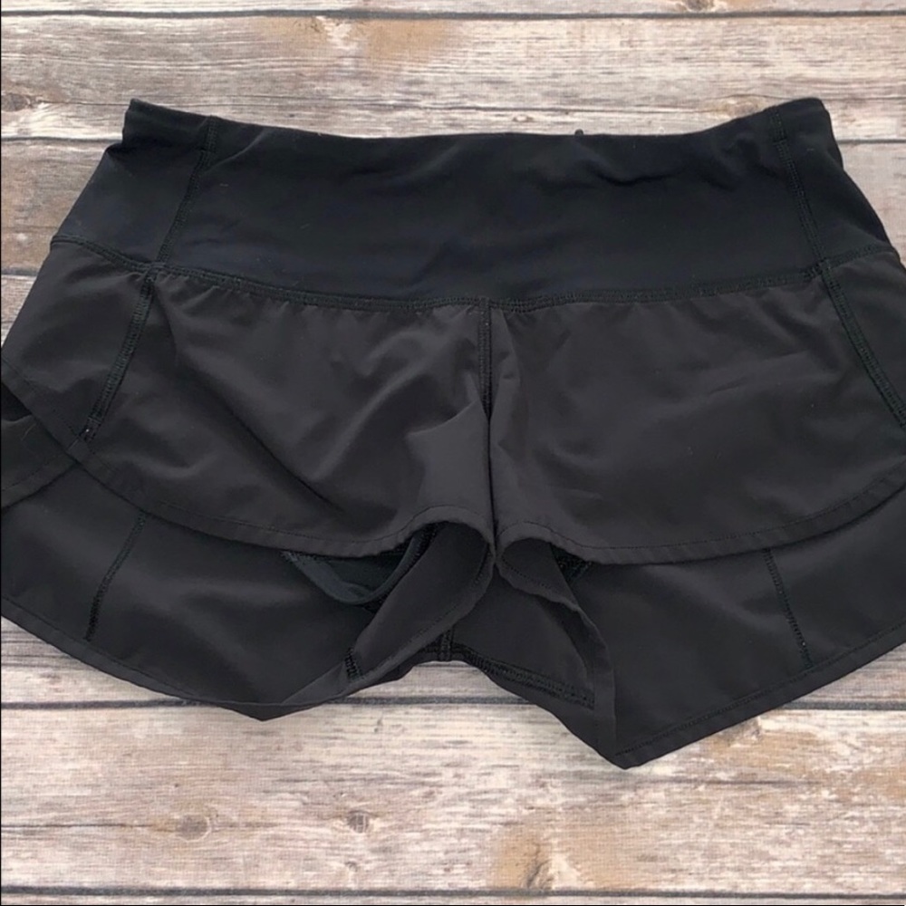 Woman’s black Lululemon speed shorts